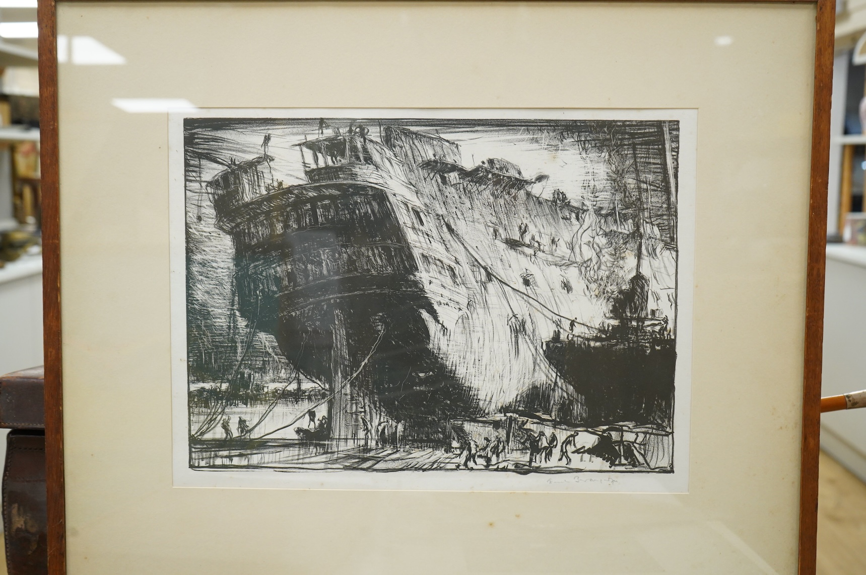 Frank Brangwyn RA RWS RBA (Welsh, 1867-1956), ‘Breaking up the Caledonia’, signed in pencil, lithograph, 28 x 37cm, together with a hardback book, Masters of Etching No.1 Frank Brangwyn and two modern woodcutters booklet